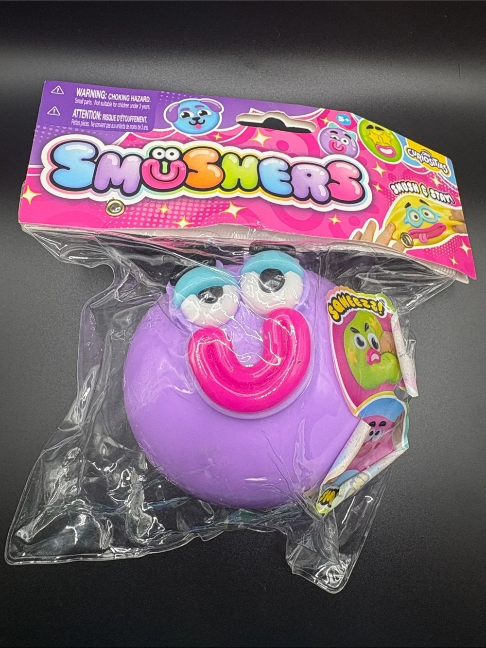 Smushers Purple Squeeze Toy with Pink Mouth and Blue Eyes